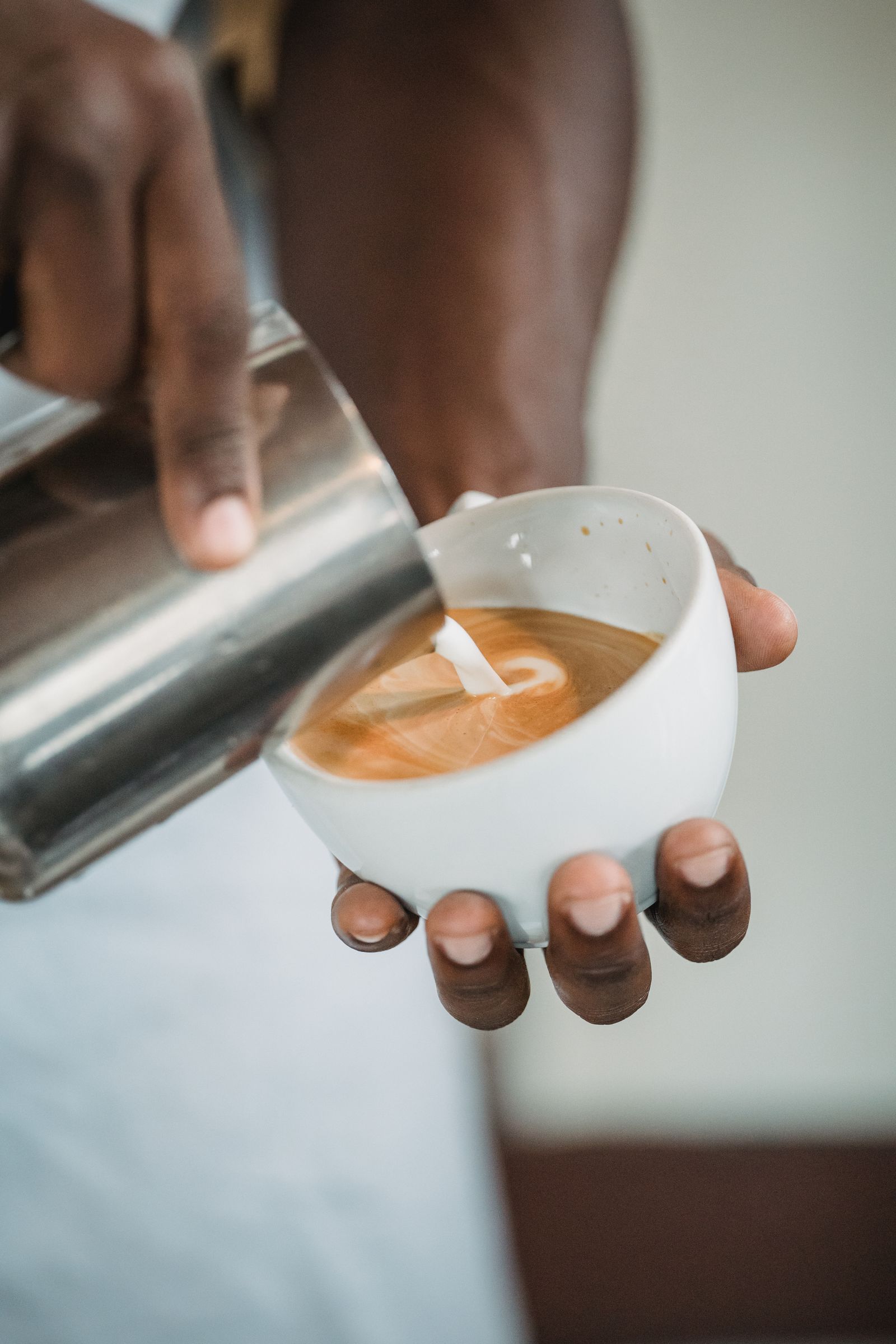 Barista pouring latte art