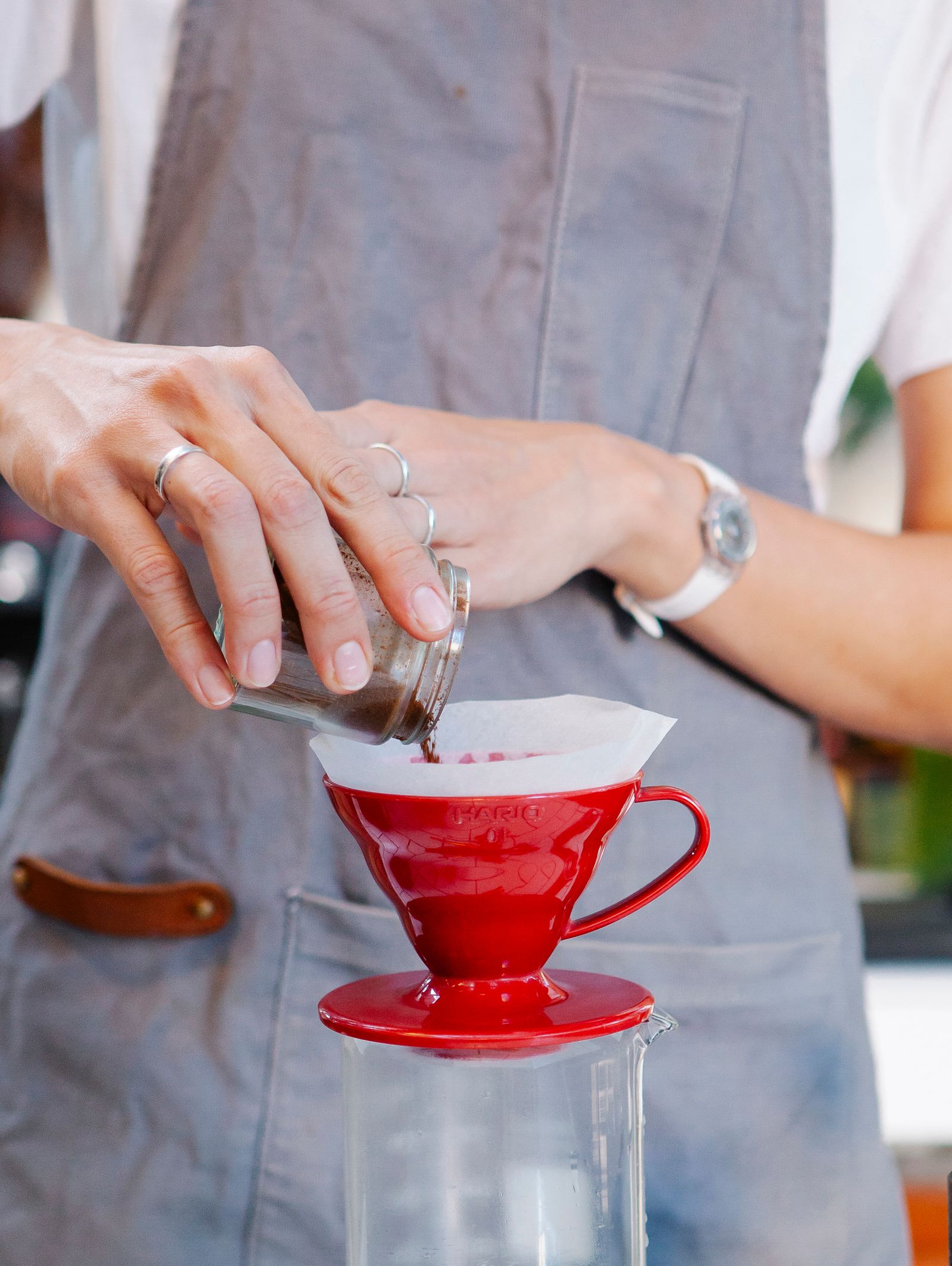 Barista pouring filter coffee